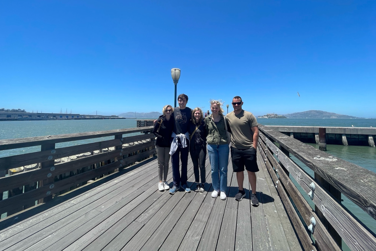 Georgetown students, faculty, and mentors standing on a dock in Northern California 